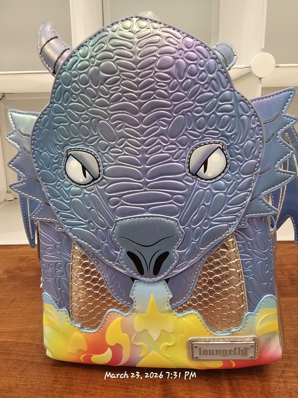 BAM Exclusive Loungefly Iridescent Dragon Backpack in Blue with Rainbow Flames